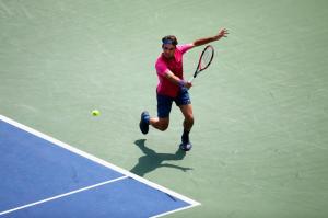 CINCINNATI, OH - AUGUST 23: Roger Federer of Switzerland returns a shot to Novak Djokovic of Serbia during the finals of the Western & Southern Open at the Linder Family Tennis Center on August 23, 2015 in Cincinnati, Ohio. (Photo by Rob Carr/Getty Images)